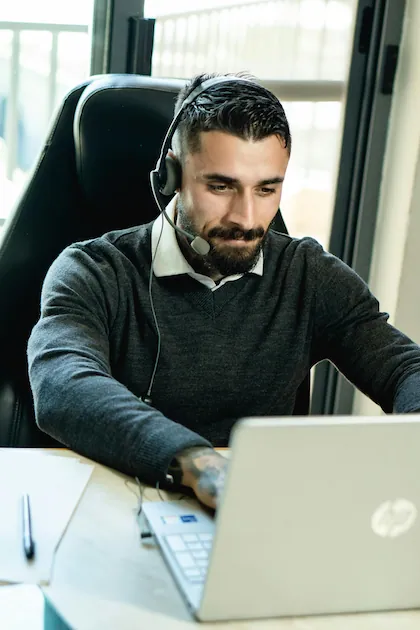 A truck dispatcher negotiating freight rates with a broker