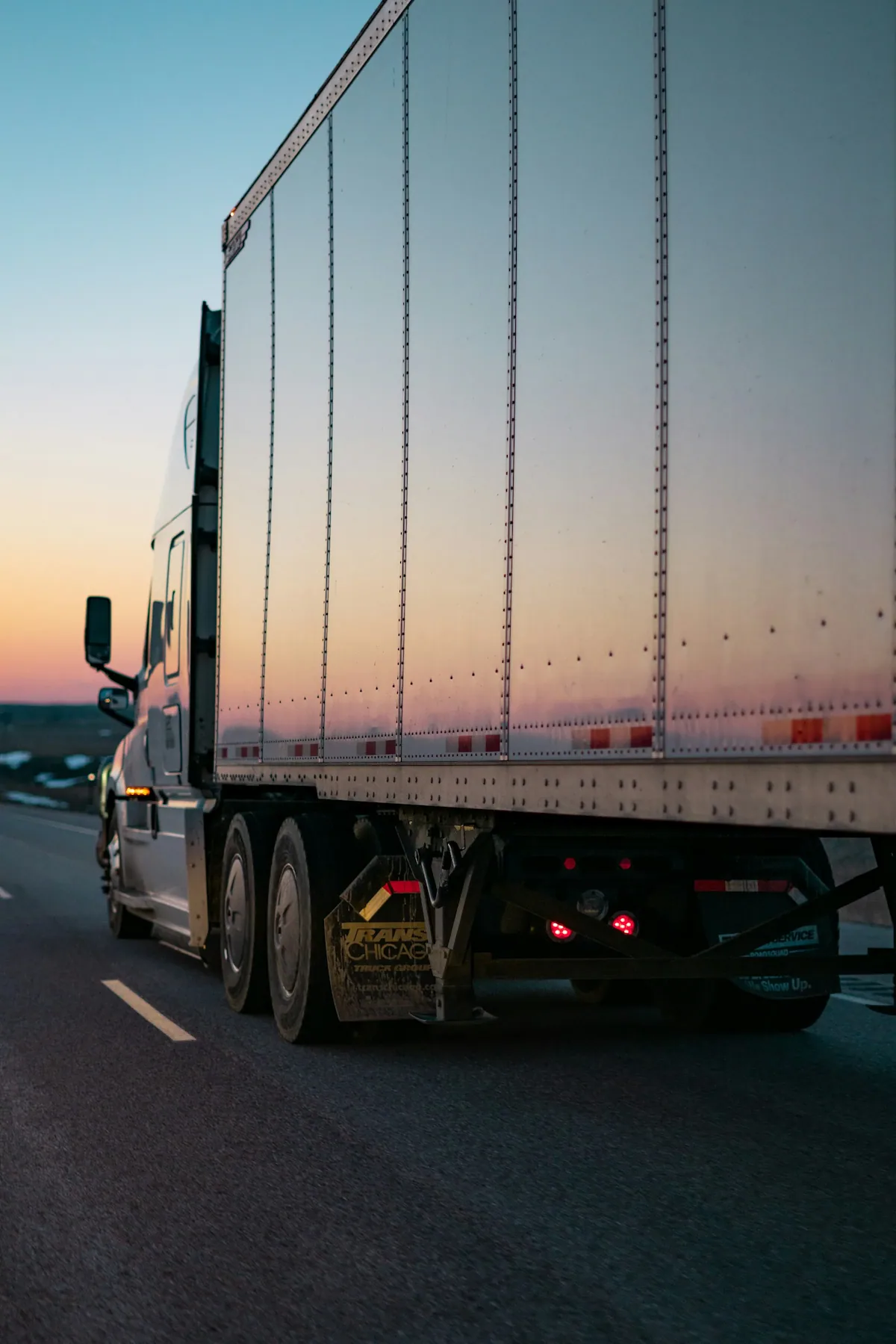 OTR owner-operator driving his truck hauling a load with a dry van trailer